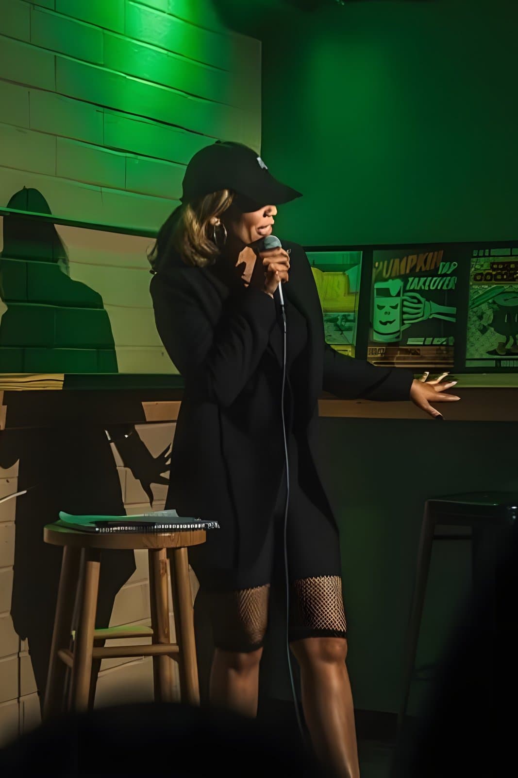 Sheryll Wade performing live stand-up comedy at a venue in the Triangle NC